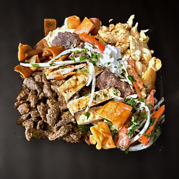 A tray of chicken shawarma, beef shawarma and beef kebab with hummus and salad
